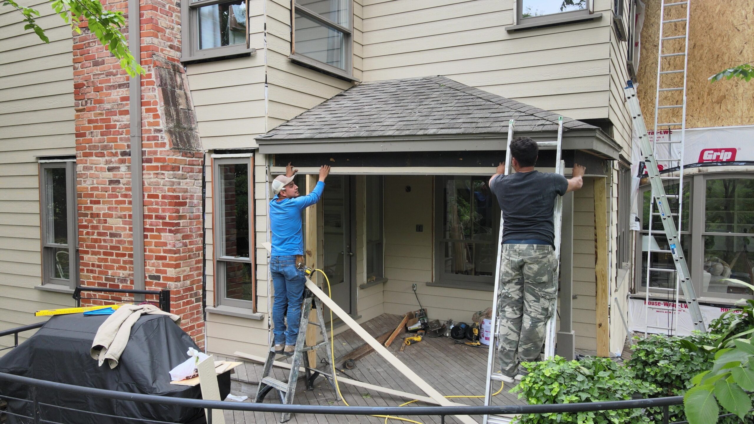 Home with decorative shutters by Scott Exteriors